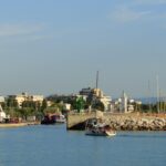 Rimini harbour with the famous Ferris wheel, marina, lighthouse and Adriatic waterfront on Italy's Adriatic coast.