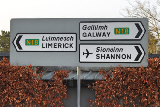 Road signs directing traffic towards Shannon Airport, Galway and Limerick