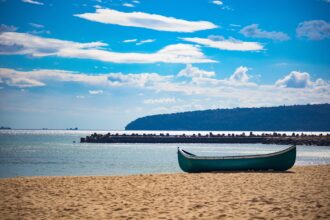 Sandy beach and small boat on Bulgaria's Black Sea coast near Varna.