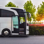 Terravision-style airport transfer coach parked beside a road, representing affordable airport bus services across Europe.