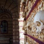 Human skulls and bones inside the Capela dos Ossos in Faro, Portugal.