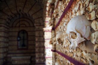 Human skulls and bones inside the Capela dos Ossos in Faro, Portugal.