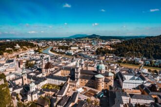 Panoramic aerial view of Salzburg Old Town, Salzburg Cathedral and the Salzach River in Austria.