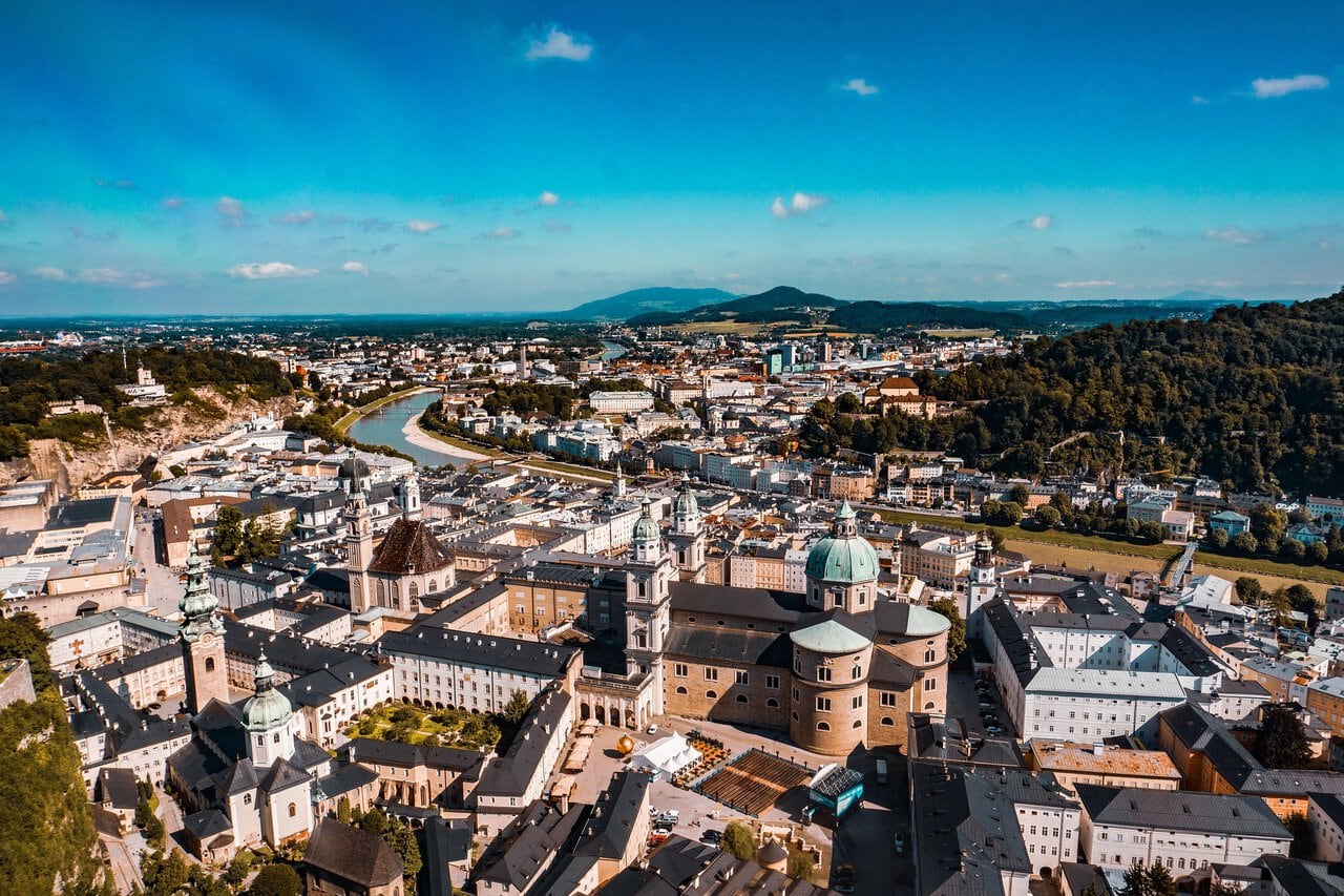 Panoramic aerial view of Salzburg Old Town, Salzburg Cathedral and the Salzach River in Austria.