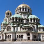 Alexander Nevsky Cathedral in Sofia under a clear blue sky.