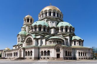 Alexander Nevsky Cathedral in Sofia under a clear blue sky.