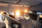 Business class airline suite illustrating reward flights and points travel using Seats.aero and Rooms.aero