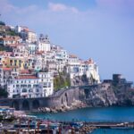 Amalfi Coast viewed from a ferry with cliffs and coastal villages