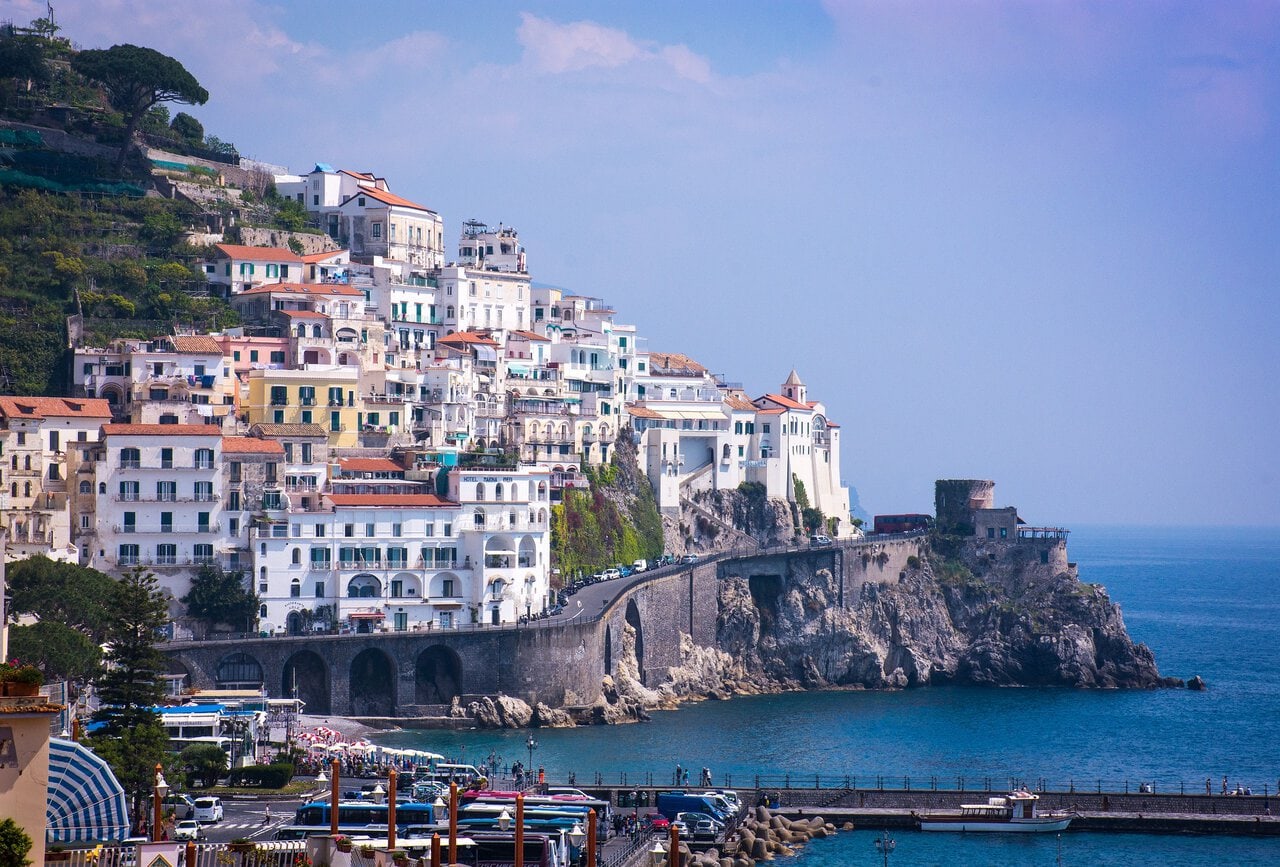Amalfi Coast viewed from a ferry with cliffs and coastal villages