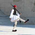 An Evzone ceremonial guard marching outside the Greek Parliament in Athens.