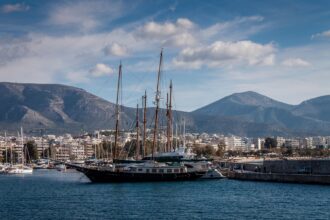 Luxury sailing yachts moored at a marina near Athens, a popular departure point for day cruises to the Greek Islands.