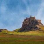 Lindisfarne Castle on Holy Island surrounded by the Northumberland landscape