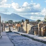 Ancient streets of Pompeii with Mount Vesuvius behind