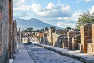 Ancient streets of Pompeii with Mount Vesuvius behind