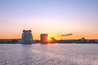 Cardiff Bay waterfront and cruise port area at sunset