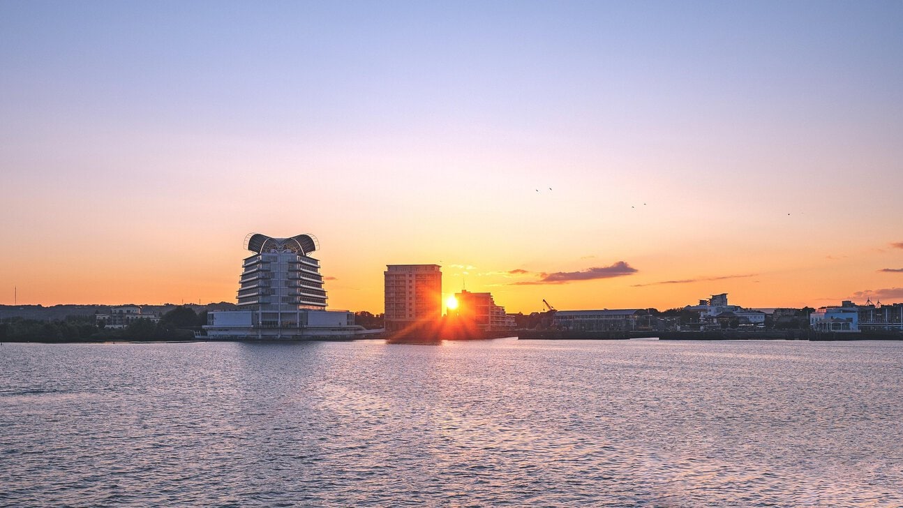 Cardiff Bay waterfront and cruise port area at sunset