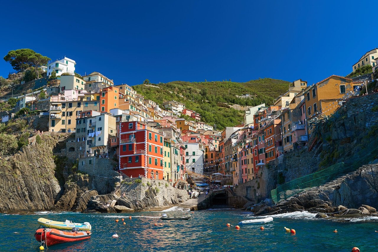 Colourful waterfront and harbour at Riomaggiore viewed from the sea in Cinque Terre.