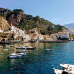 Amalfi Coast town with colourful buildings built into the cliffs above the sea