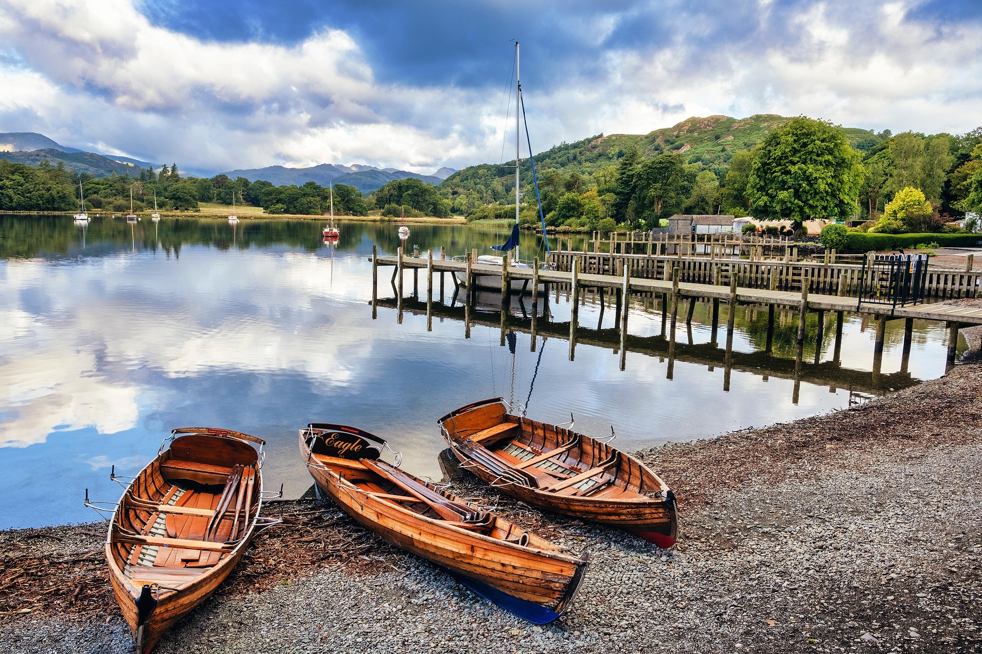 Wooden rowing boats beside a lake in the Lake District
