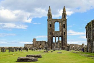 Ruins of St Andrews Cathedral in St Andrews, Fife, Scotland under a dramatic blue sky