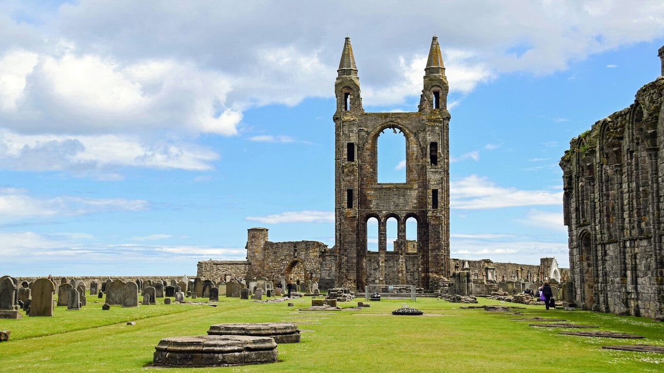 Ruins of St Andrews Cathedral in St Andrews, Fife, Scotland under a dramatic blue sky
