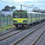 Dublin DART train travelling along the railway line in County Dublin.