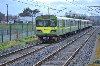 Dublin DART train travelling along the railway line in County Dublin.