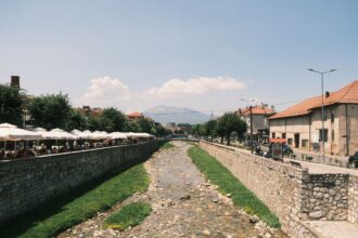 River and city centre in Prizren, Kosovo, connected by bus services