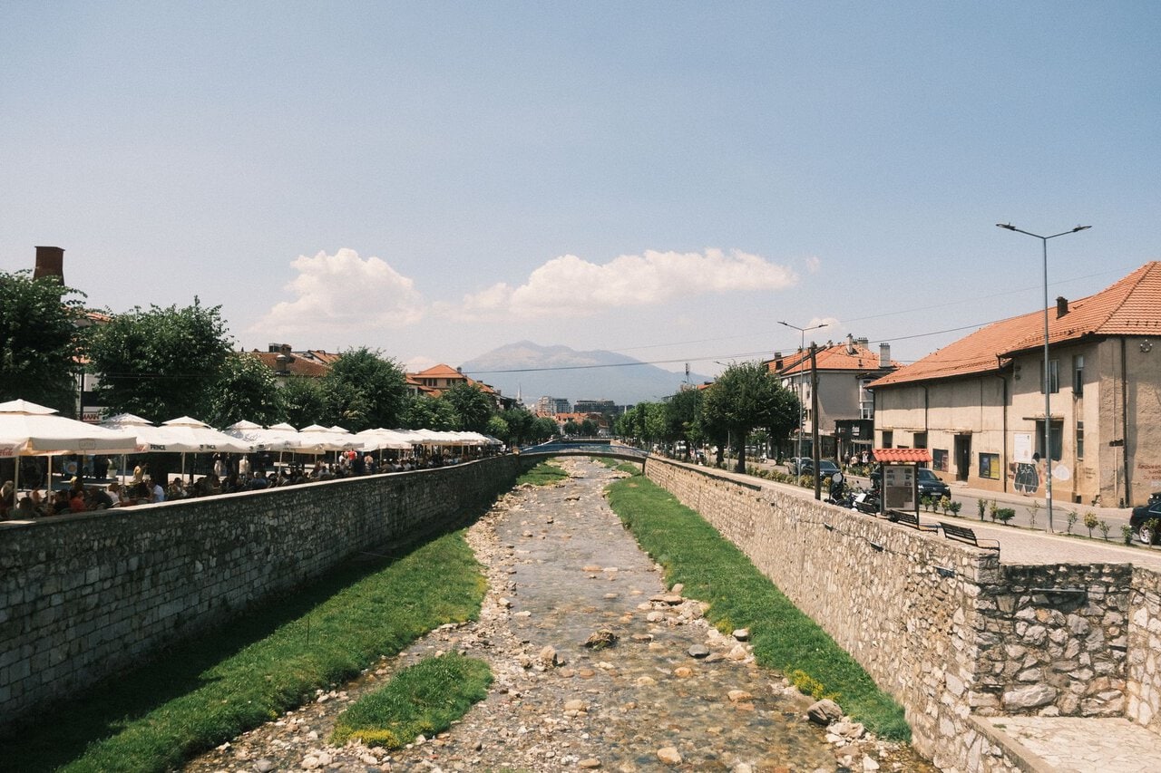 River and city centre in Prizren, Kosovo, connected by bus services