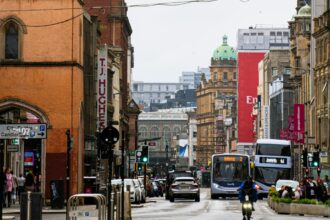 Glasgow city centre with buses and cyclists