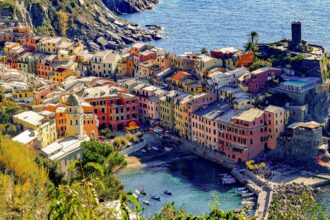 Colourful buildings overlooking Vernazza harbour in Cinque Terre on the Ligurian coast of Italy.