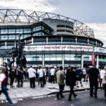 Twickenham Stadium exterior with rugby supporters arriving before an England rugby match