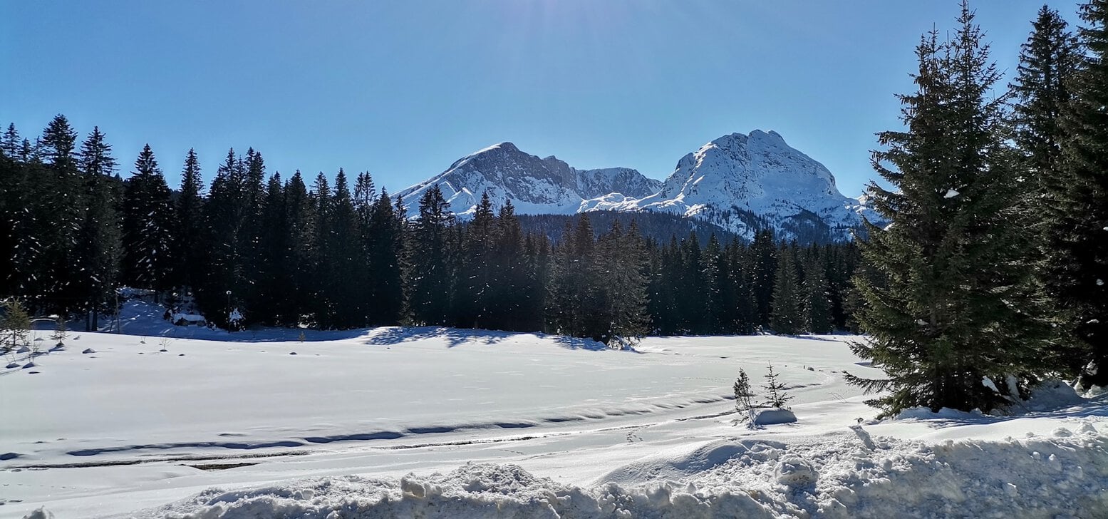 Frozen Black Lake surrounded by Durmitor mountains
