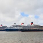 Cunard's Queen Mary 2, Queen Elizabeth and Queen Victoria sailing together on the River Mersey in Liverpool during a historic fleet gathering.