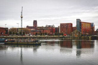 Liverpool waterfront viewed from the Royal Albert Dock during a sightseeing cruise on the historic docks.