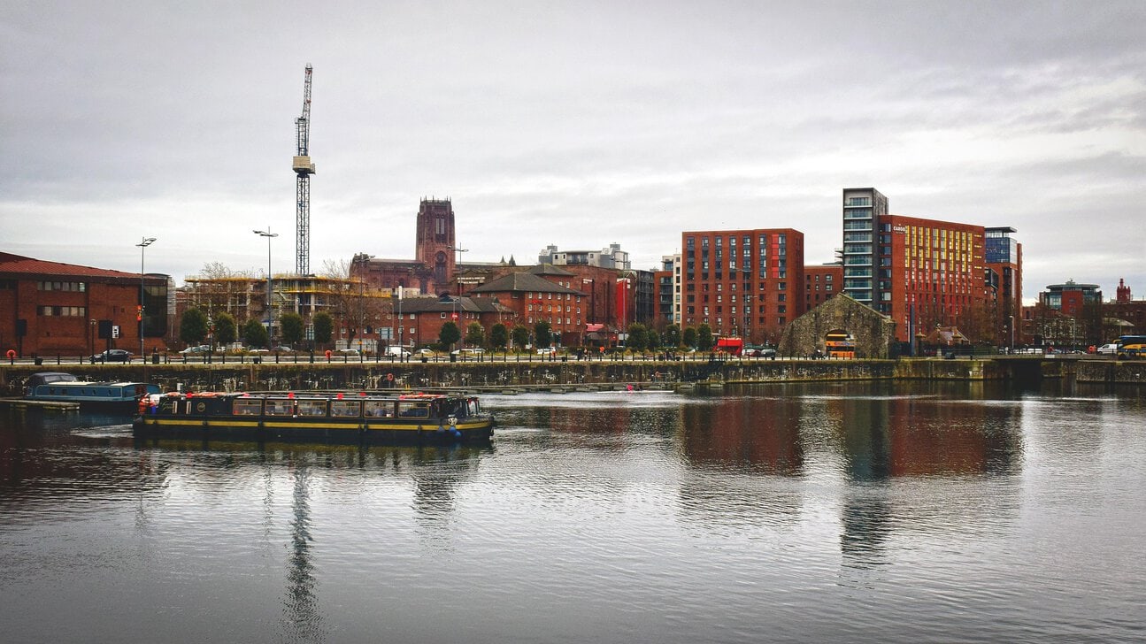 Liverpool waterfront viewed from the Royal Albert Dock during a sightseeing cruise on the historic docks.