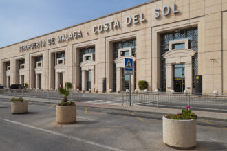 Exterior of Malaga Costa del Sol Airport terminal building with the main entrance to the arrivals and departures area.