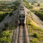 Modern passenger train travelling through the Montenegrin countryside