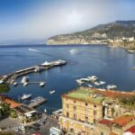 View across the Bay of Naples from Sorrento with boats in the harbour