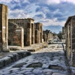 Ancient Roman street in Pompeii viewed towards Mount Vesuvius