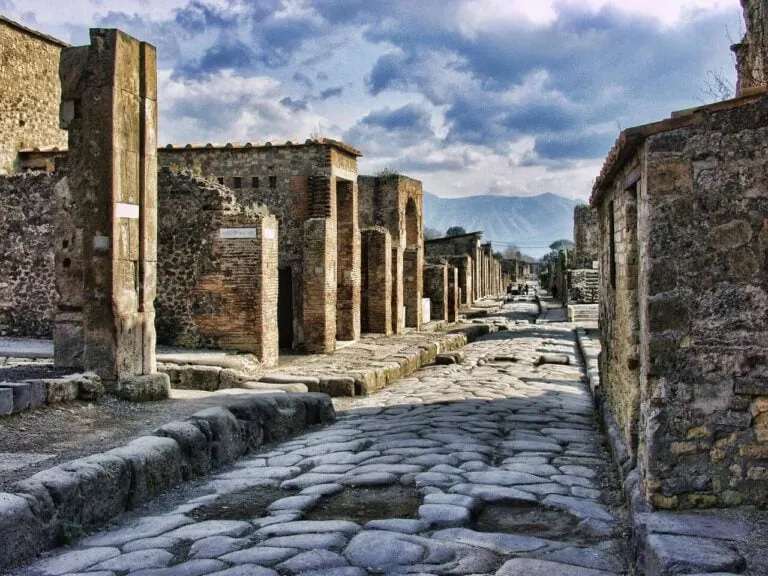 Ancient Roman street in Pompeii viewed towards Mount Vesuvius
