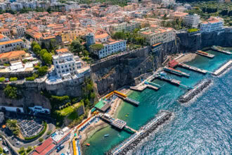 Sorrento coastline with beaches and swimming platforms beneath the cliffs