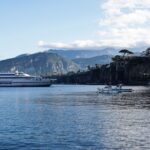 Ferry arriving at Sorrento Marina with cliffs and coastline in the background