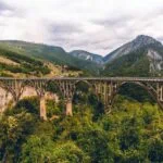 Tara River Canyon surrounded by forested mountains in Montenegro