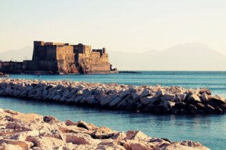 Castel dell'Ovo overlooking the Bay of Naples with Mount Vesuvius in the background
