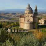Panoramic view of Siena with Siena Cathedral rising above the medieval city skyline in Tuscany, Italy.