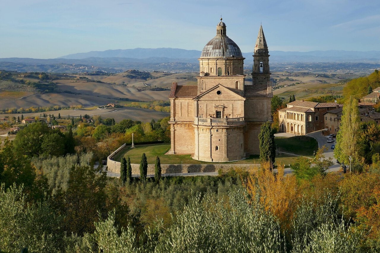 Panoramic view of Siena with Siena Cathedral rising above the medieval city skyline in Tuscany, Italy.