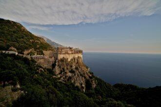Simonopetra Monastery perched dramatically on the cliffs of Mount Athos overlooking the Aegean Sea.