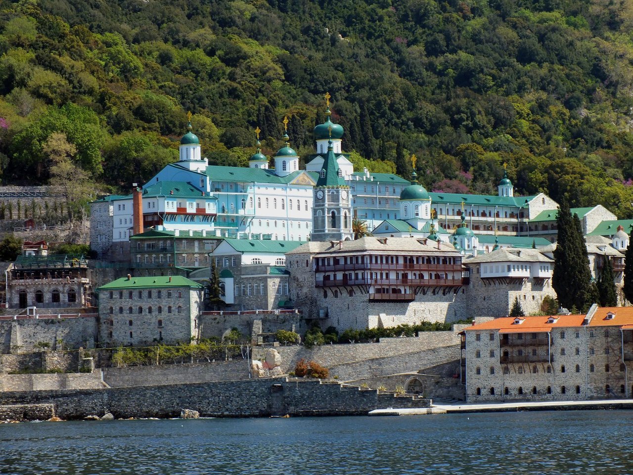 St Panteleimon Monastery on Mount Athos with its distinctive green domes overlooking the waterfront.