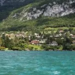 Annecy Mont-Blanc Airport terminal with the Alps and Lake Annecy in the background